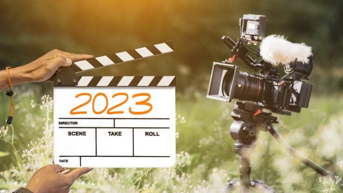 2023 Handwritten On Film Clapperboard Film Crew Holding Film Clapperboard And A Camera Filming A Movie In The Outdoor Background For Creator Content In New Year